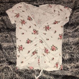 adjustable floral top. slightly worn. ties in the middle move and work.